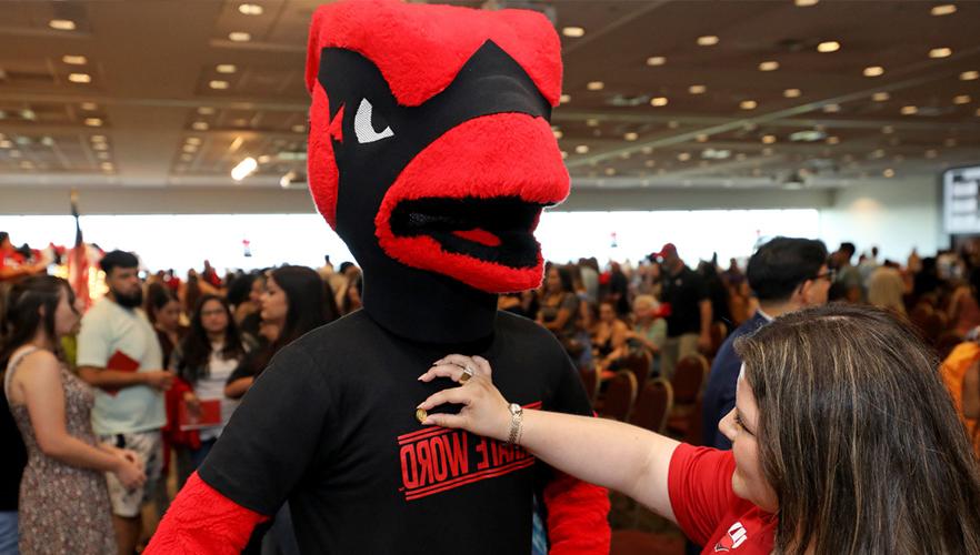 Red the cardinal being pinned on shoulder