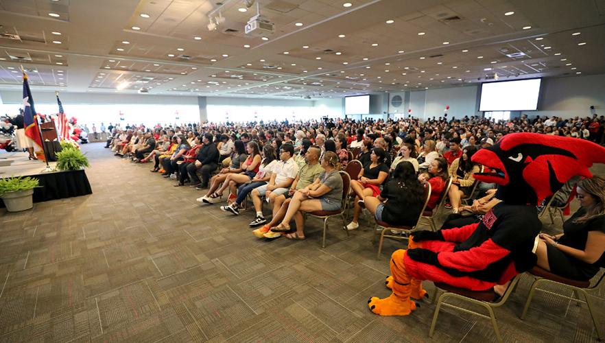 students watching speaker at pinning day